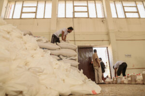 Food aid is prepared for distribution at a warehouse