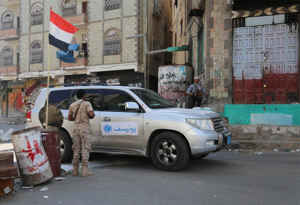 UNICEF vehicle stops at a checkpoint in Taiz city