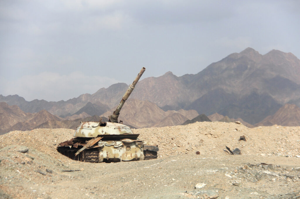 A damaged tank is abandoned along the Shabwa