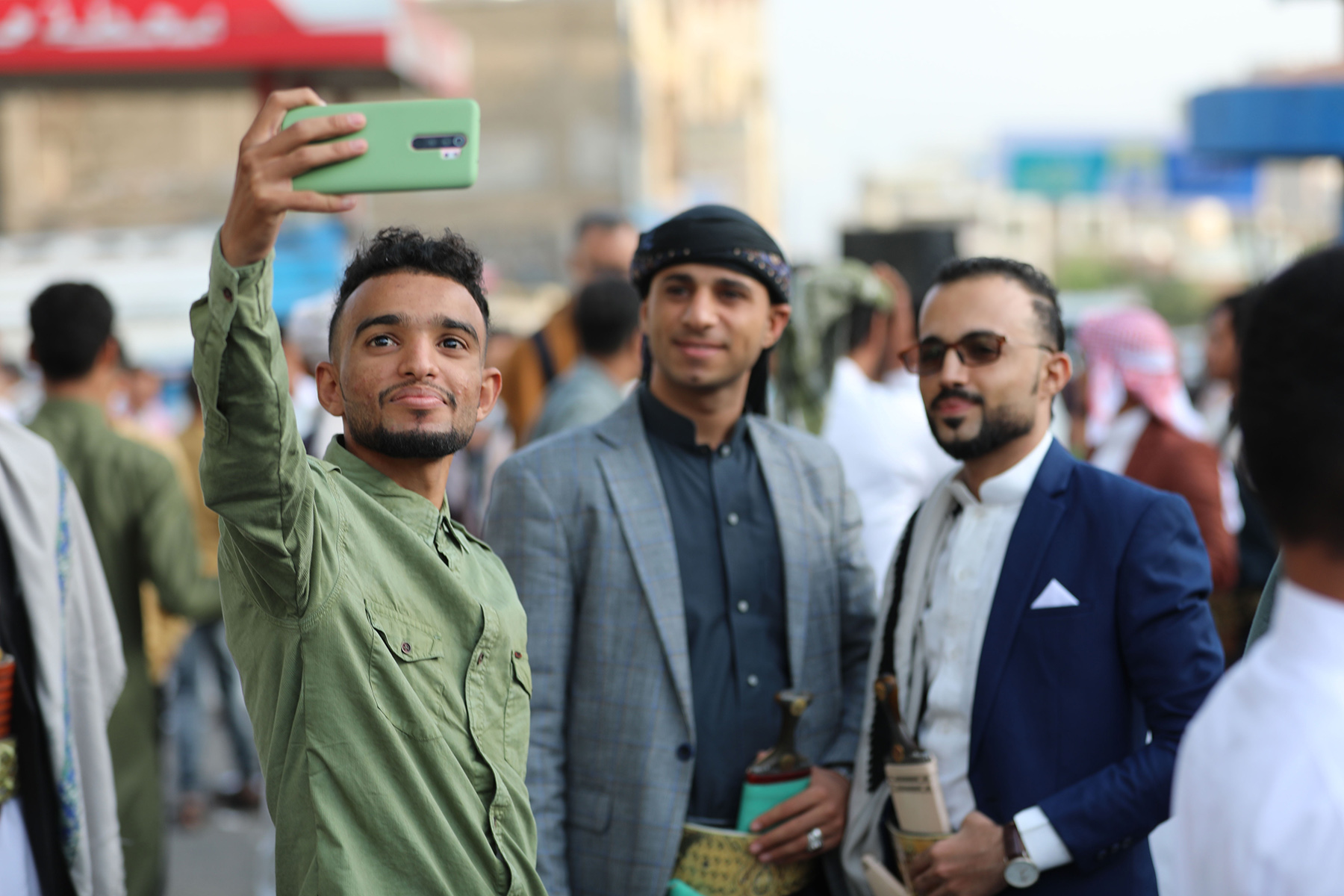 Young-men-take-a-photo-in-Taiz.jpg